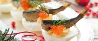 Stuffed eggs with sprats and red caviar