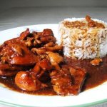 Fricassee. What is it, chicken with champignons, mushrooms, rice, vegetables 