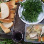 Ready-made fish soup with bread and herbs