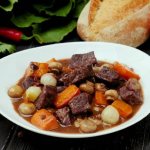 Beef Bourguignon. Classic recipe in red wine with mushrooms, baby potatoes, mashed potatoes, port wine sauce, bouquet garni 