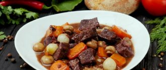 Beef Bourguignon. Classic recipe in red wine with mushrooms, baby potatoes, mashed potatoes, port wine sauce, bouquet garni 