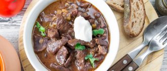Beef heart goulash with gravy in a frying pan. Recipe 