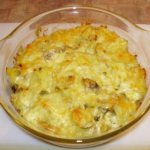Potatoes with champignons and cheese in the oven