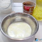 Kefir is poured into a bowl and soda is added