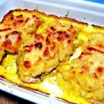 Chicken chops with pineapple and cheese on a fine grater