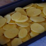 Potato slices in a baking dish