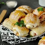 Puff pastry rolls with sausage and cheese