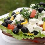 Greek salad: classic recipe, with feta cheese, fetax, mozzarella, chicken