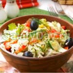 Vegetable salad with canned corn and olives