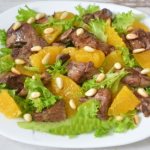 Warm salad with chicken liver. Recipe with arugula, orange, mushrooms, pear, grapes, honey, from Vysotskaya, Zimin, Lazerson 